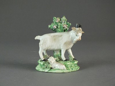 Lot 294 - Staffordshire model of a goat and kid