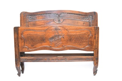 Lot 307 - A French Louis XV style mahogany bedstead