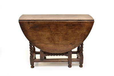 Lot 329 - An 18th century oak gateleg table