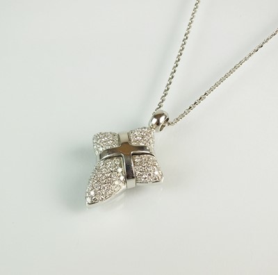 Lot 157 - A diamond set stylised cross pendant