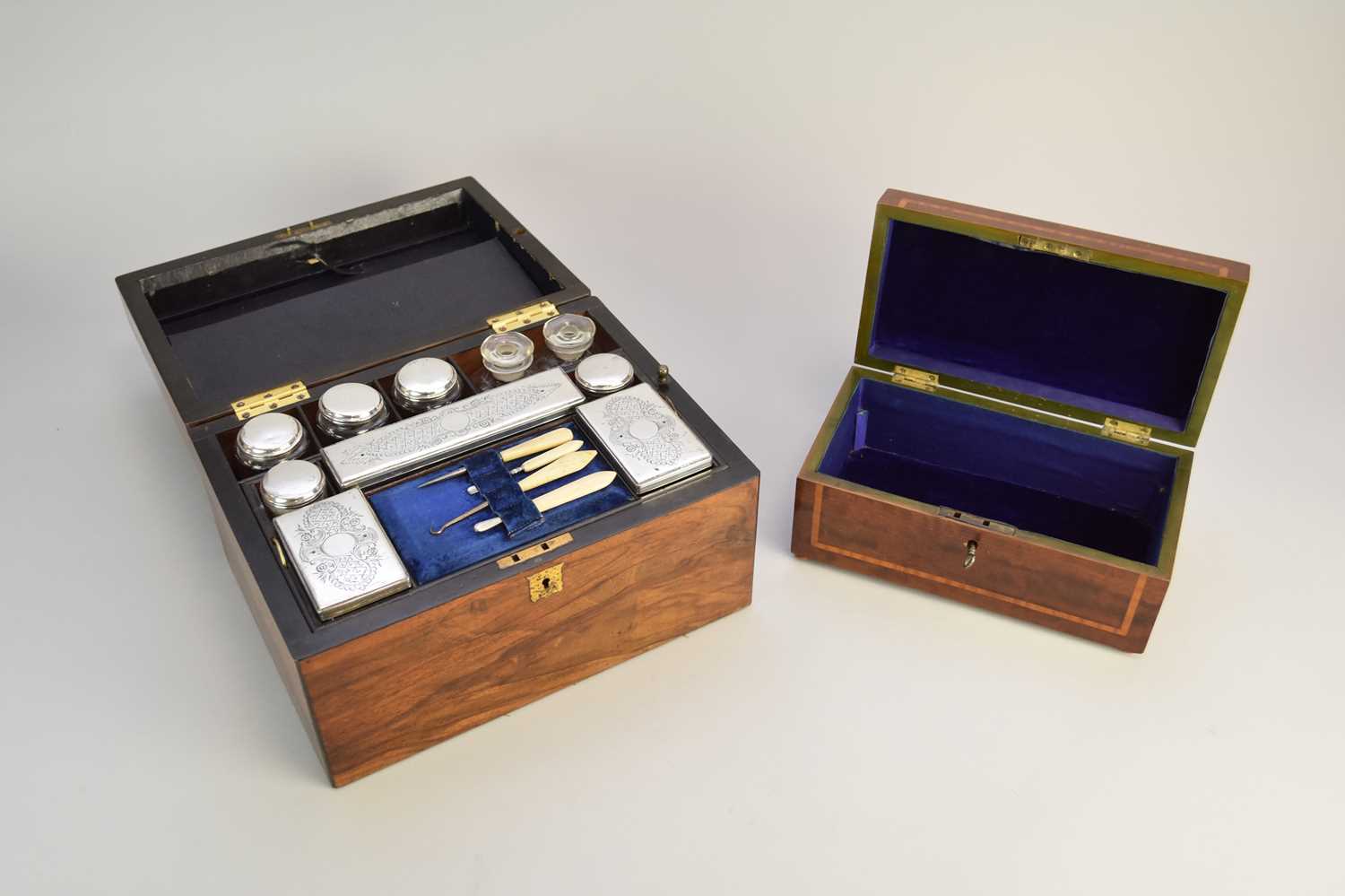 Lot 18 - A 19th century cased silver plated mounted travelling vanity set