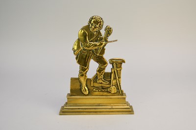 Lot 242 - A Victorian brass doorstop, in the form of a fiddler