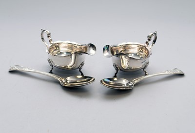 Lot 15 - A pair of silver sauce boats and a pair of silver spoons