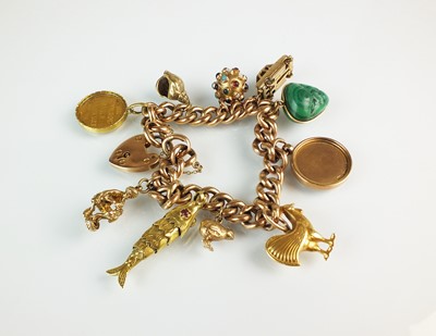 Lot 152 - A rose metal hollow curb link bracelet with attached charms