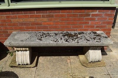 Lot 341 - A cast stone garden bench