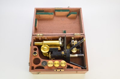 Lot 275 - A circa 1900 lacquered brass and blackened monocular microscope by J. Swift and Son, London