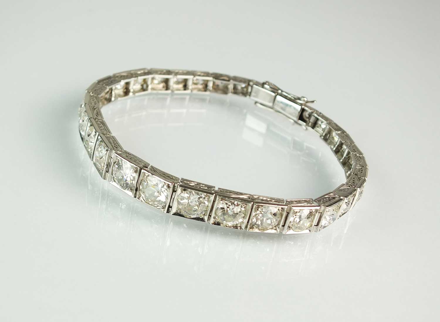 Lot 160 - A graduated diamond line bracelet
