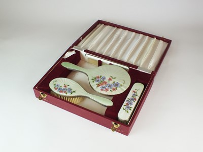 Lot 128 - A cased four piece silver and enamel dressing table set
