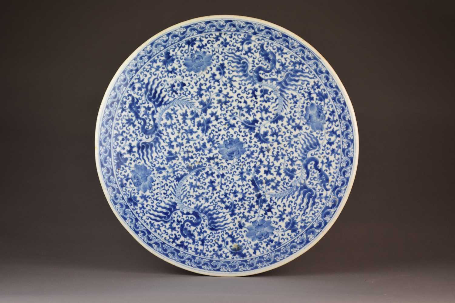 Lot 16 - A large Chinese blue and white circular plaque or table top, 19th century