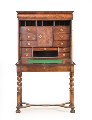 Lot 343 - A George II feather banded walnut escritoire on stand