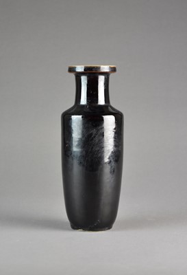 Lot 17 - A Chinese ‘mirror black’ monochrome glazed rouleau vase, 19th century