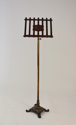 Lot 435 - A late Victorian cast iron, brass and mahogany music stand