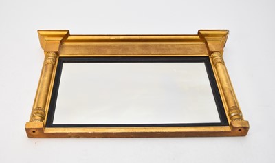 Lot 397 - A 19th century giltwood and parcel ebonised pier type mirror