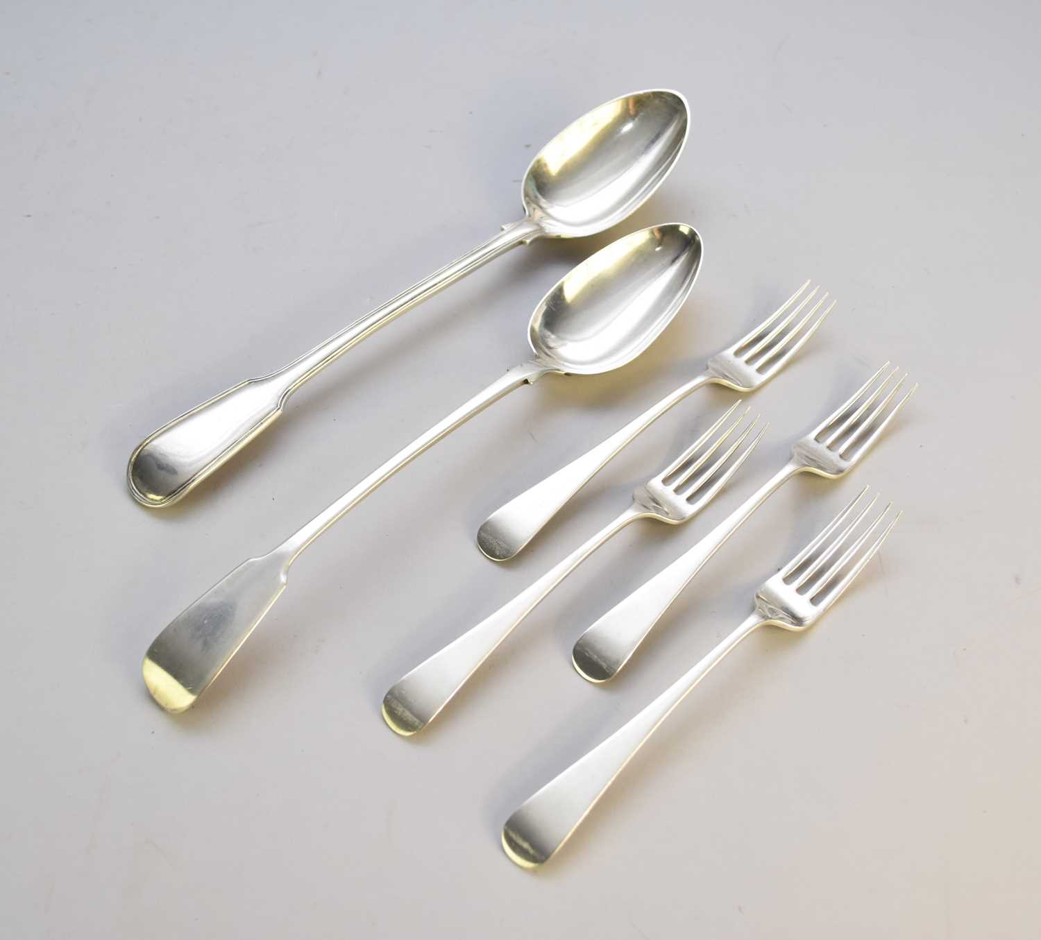 Lot 17 - Two silver basting spoons and four silver forks