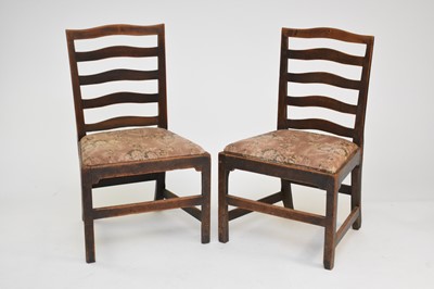 Lot 471 - A pair of fruitwood ladder back standard chairs