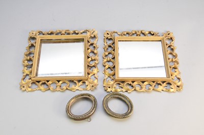 Lot 317 - A pair of giltwood wall mirrors and a pair of small oval frames