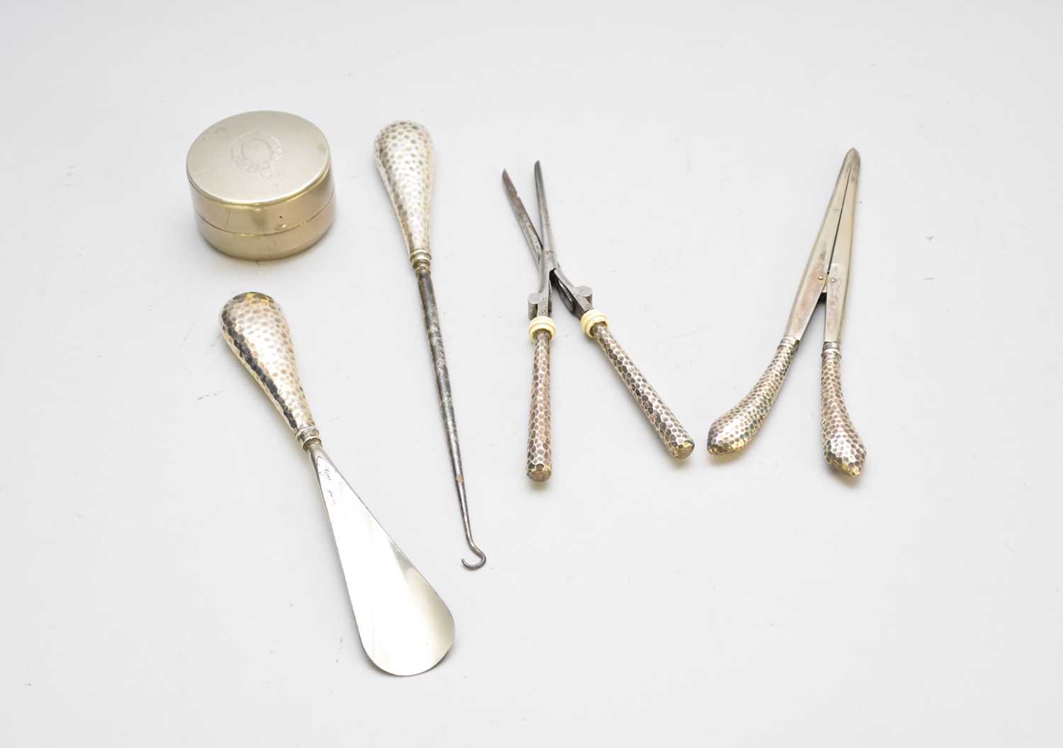 Lot 16 - A collection of silver handled implements