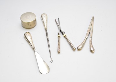 Lot 16 - A collection of silver handled implements