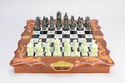 Lot 588 - A Chinese carved wood and hardstone chess compendium