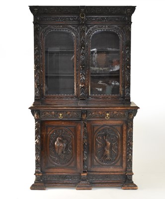 Lot 429 - A 19th century Flemish style carved oak bookcase cabinet