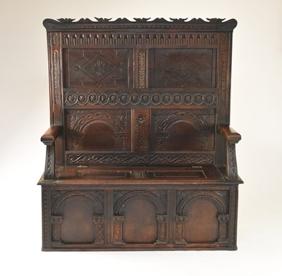 Lot 405 - A carved oak settle, 17th century and later