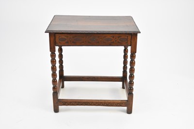 Lot 391 - An 18th century oak lowboy table, with later carving