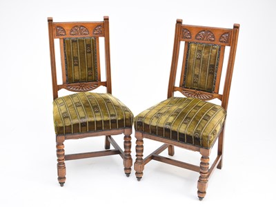 Lot 476 - A set of four upholstered oak side chairs