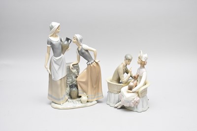 Lot 400 - Nao and Lladro porcelain models of two water carriers and a couple on a loveseat