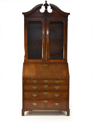 Lot 417 - A late George II and later walnut veneered bureau bookcase