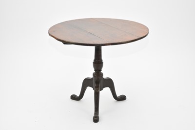 Lot 437 - An early 19th century oak tilt-top tripod table