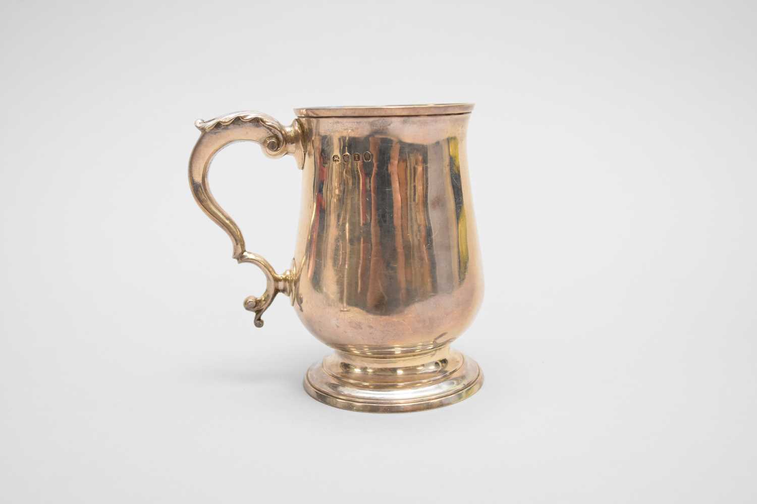 Lot 24 - A George III silver baluster mug