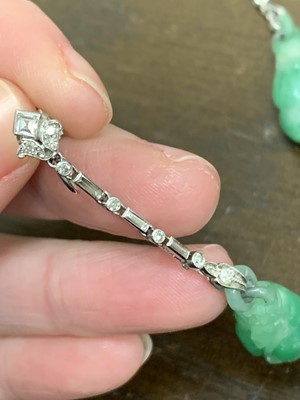 Lot 103 - A pair of jade and diamond ear pendants