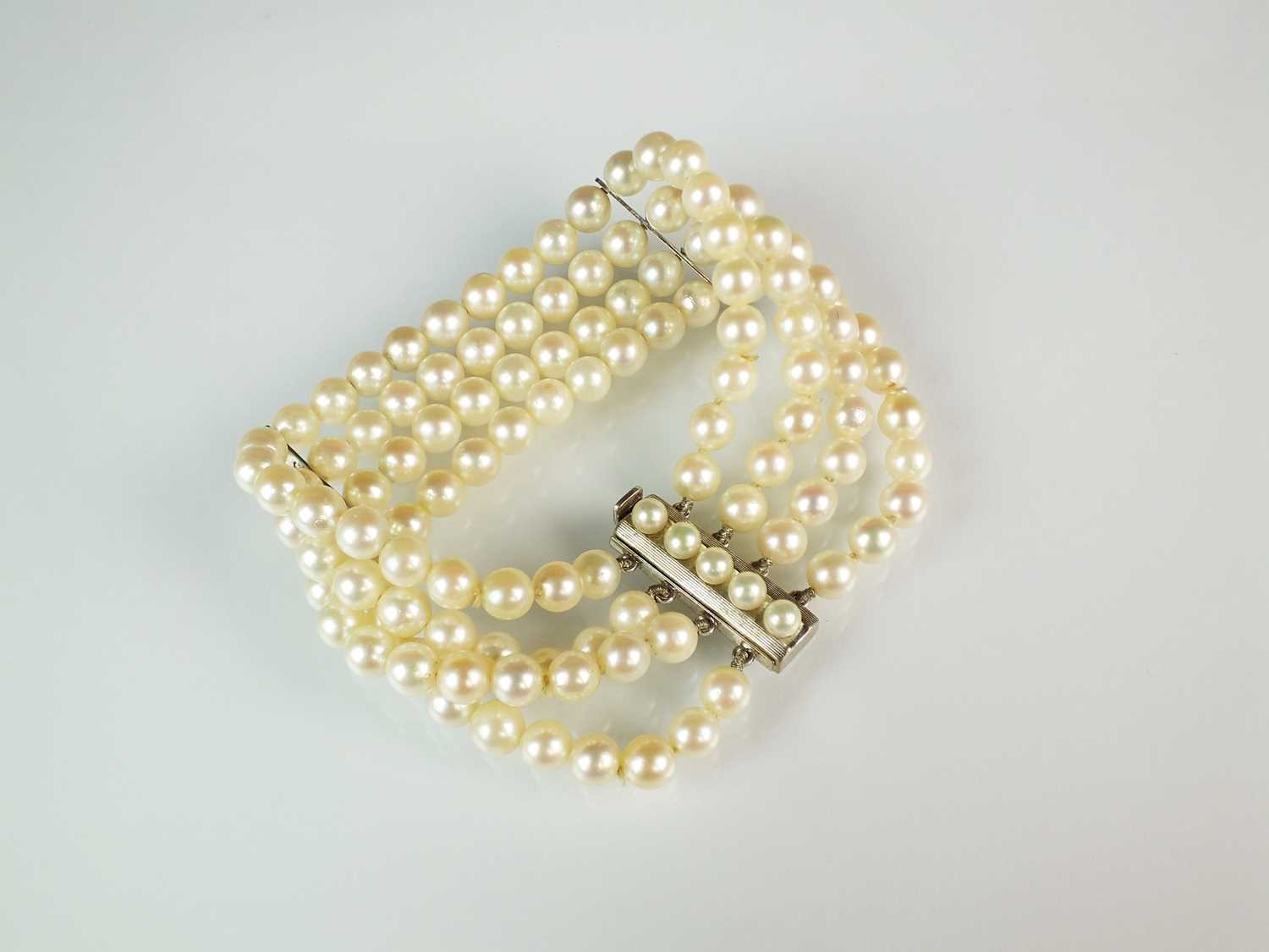 Lot 66 - A four strand uniform cultured pearl bracelet