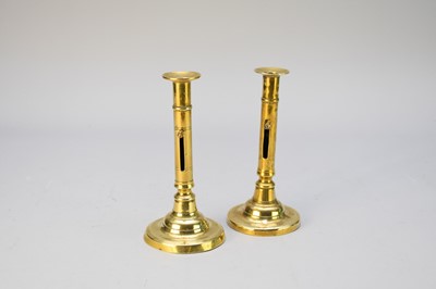 Lot 351 - A near pair of brass candlesticks