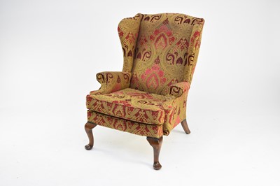 Lot 393 - An Edwardian upholstered wing armchair