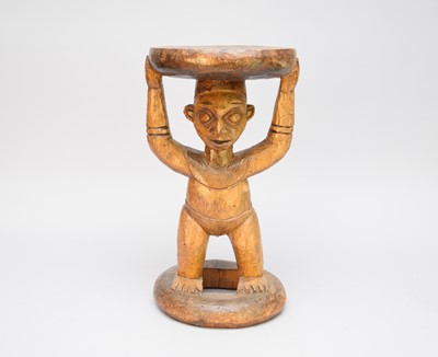 Lot 302 - A West African Cameroon caved tribal figural stool