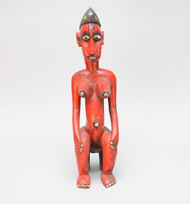 Lot 309 - A West African Bobo red painted seated female figure