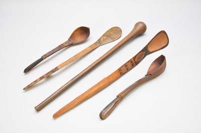 Lot 307 - An East African Masai tribal club and four Tanzanian Swahili spoons