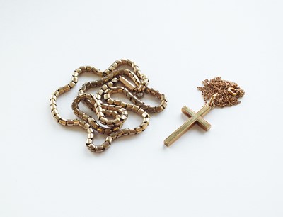 Lot 312 - Two yellow metal chains and a crucifix pendant