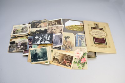 Lot 444 - A collection of Edwardian postcards in two...