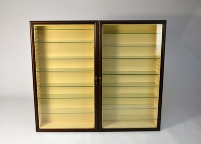 Lot 53 - A set of three mahogany effect wall hanging...