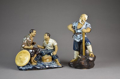 Lot 409 - Two Chinese stoneware figures of farmers, Republic