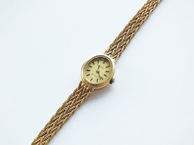 Lot 326 - A 9ct gold Tissot bracelet quartz wristwatch