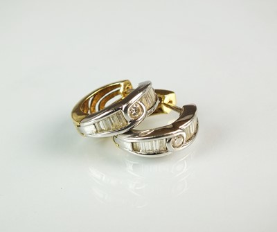 Lot 122 - A pair of 18ct gold diamond set hoop earrings