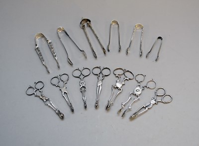 Lot 298 - A collection of silver sugar nips and tongs