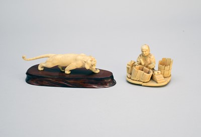 Lot 405 - A Japanese ivory okimono of a tiger and another of an artisan