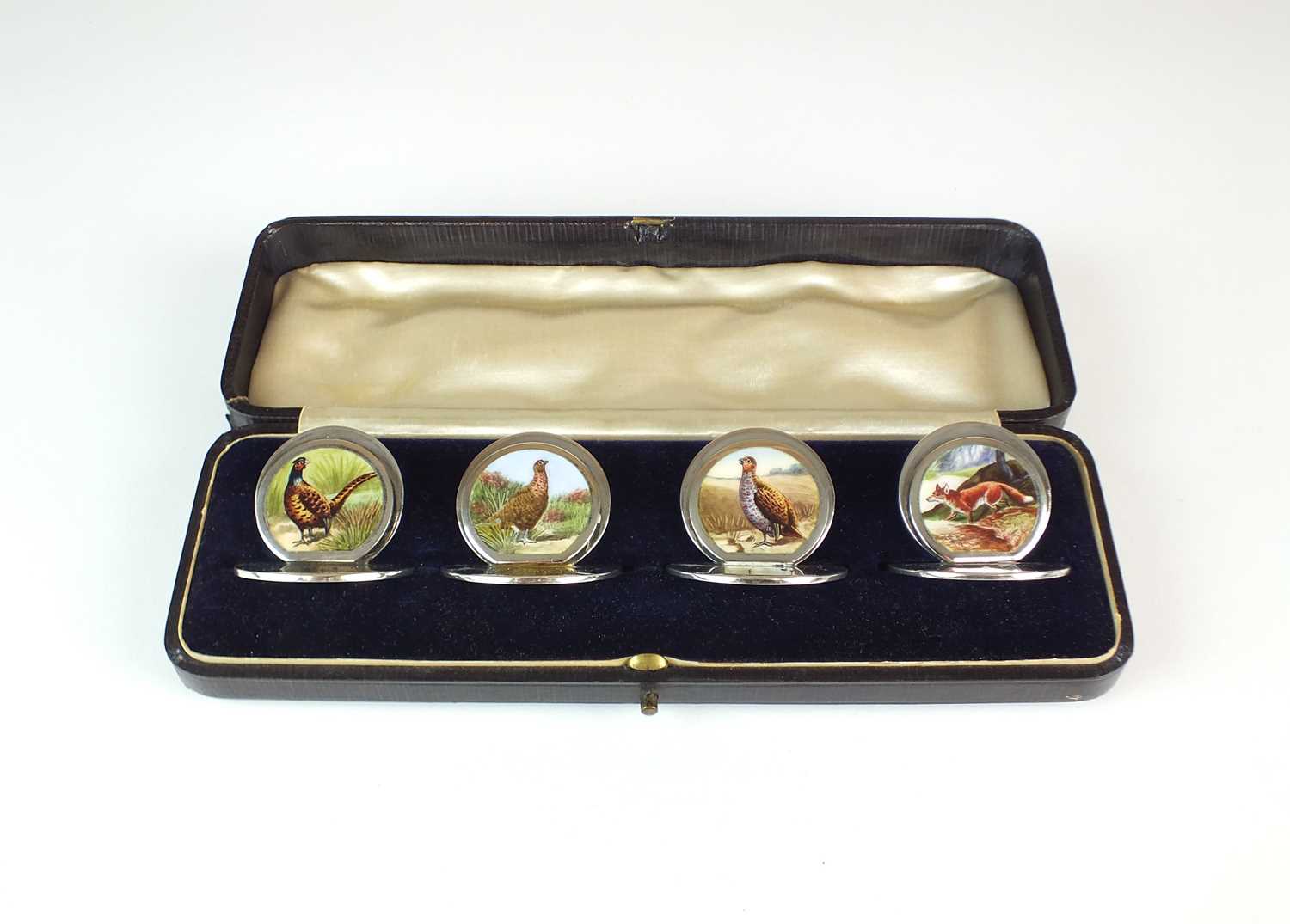 Lot 38 - An Edwardian cased set of four silver and enamel menu holders by Sampson Mordan & Co Ltd