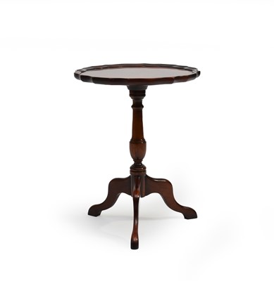 Lot 326 - A mahogany 'pie crust' wine table by Charles Barr