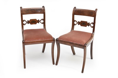 Lot 380 - A set of five Regency inlaid mahogany sabre-leg standard chairs and two others