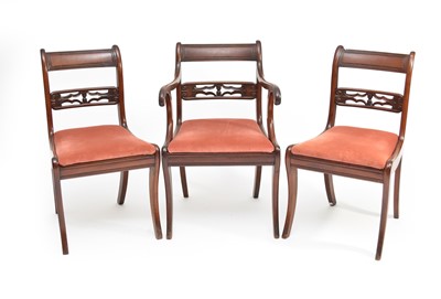 Lot 394 - A set of six (5+1) George III mahogany sabre-leg dining chairs